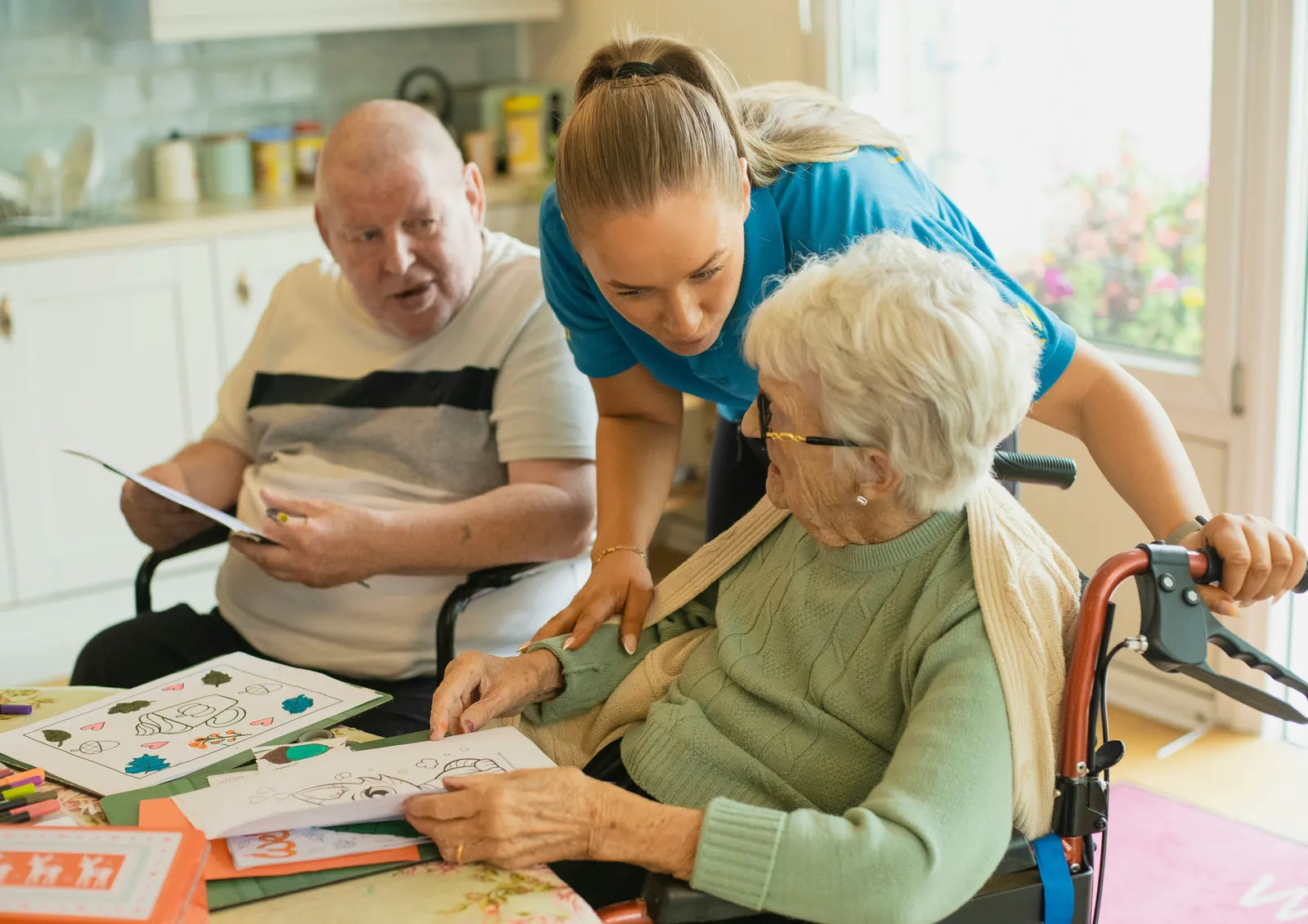 Care provider offering attentive support to older adults at home